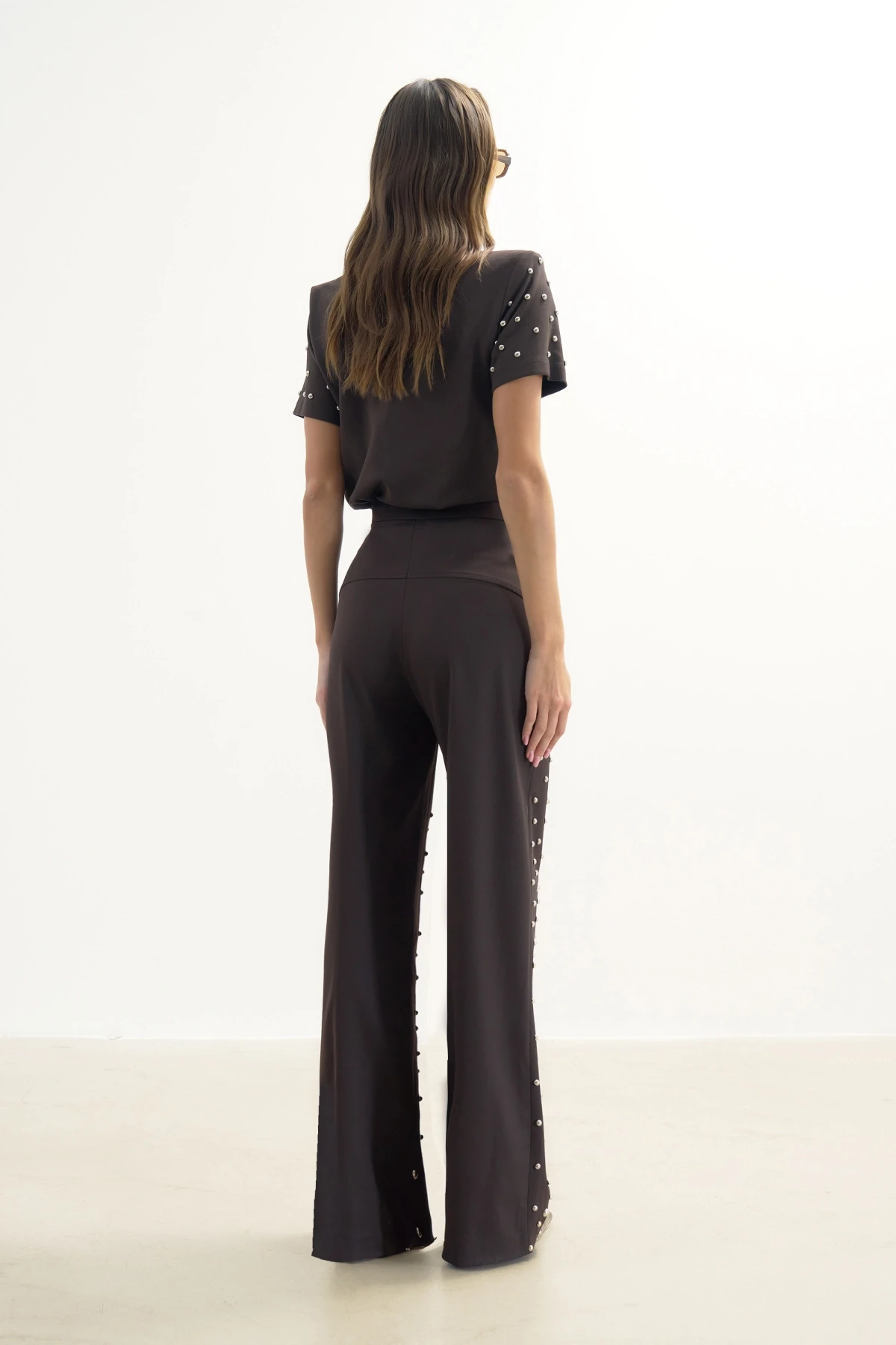 BROWN TROUSERS WITH METALLIC STONE PRINT