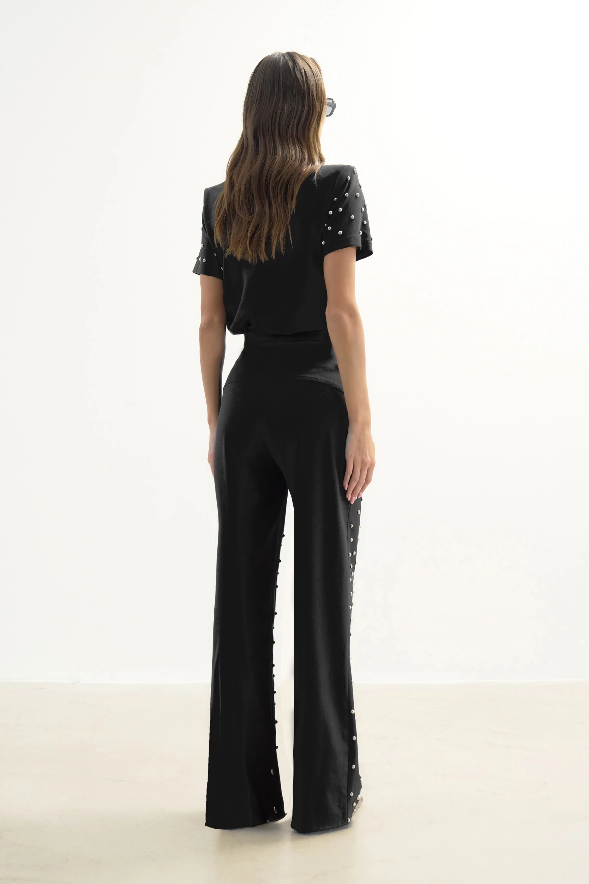 BLACK TROUSERS WITH METALLIC STONE PRINT