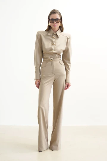 BEIGE SHIRT WITH GOLD BUTTONS AND BROWN STITCHING DETAIL